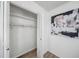 Walk in closet with white walls, hanging rack and modern artwork at 3001 W Potomac Dr, Atlanta, GA 30344