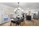 Bright dining area with modern chandelier, walk out to the deck, and is right off of the kitchen at 3001 W Potomac Dr, Atlanta, GA 30344