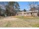 Back exterior of home with a swing set on a large backyard at 4775 Hemlock Se Dr, Conyers, GA 30094