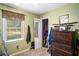 Bedroom features a closet, window and a wood dresser at 4775 Hemlock Se Dr, Conyers, GA 30094