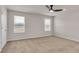 Spacious bedroom with neutral walls, plush carpet, and a modern ceiling fan at 654 Egrets Lot 65 Lndg, Covington, GA 30014