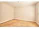 Neutral bedroom with carpeted floor, base trim, and no furniture at 722 Richmond Ct, Loganville, GA 30052