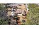 Aerial view of a property featuring mature trees, professional landscaping, and a private driveway at 3401 Lori Ln, Atlanta, GA 30340