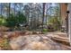 Beautiful backyard featuring a stone patio, lush greenery and covered gazebo at 3401 Lori Ln, Atlanta, GA 30340