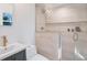 Updated bathroom featuring a blue vanity, white countertops, and a glass-enclosed tiled walk-in shower at 3401 Lori Ln, Atlanta, GA 30340