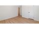 Minimalist bedroom featuring hardwood floors, white walls, and a double door closet at 3401 Lori Ln, Atlanta, GA 30340