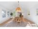 Bright dining room with modern lighting, hardwood flooring and natural light at 3401 Lori Ln, Atlanta, GA 30340