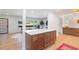 Open concept living room featuring hardwood flooring, a quartz island and natural light at 3401 Lori Ln, Atlanta, GA 30340