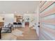 Bright, open-concept living room flowing into the kitchen, featuring hardwood floors at 3401 Lori Ln, Atlanta, GA 30340