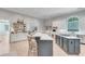 Gourmet kitchen showcasing a marble island, stainless appliances, and custom cabinetry at 5040 Blackberry Ln, Buford, GA 30518