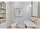 Stylish powder room with patterned wallpaper, pedestal sink, and decorative shelving at 5040 Blackberry Ln, Buford, GA 30518