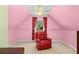 Bedroom with a red leather armchair and a window view at 735 Amberton Close, Suwanee, GA 30024