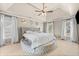 Main bedroom features stylish bed with accent ceiling, windows and mirrors at 735 Amberton Close, Suwanee, GA 30024