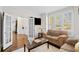 Inviting living room with hardwood floors and natural light at 735 Amberton Close, Suwanee, GA 30024