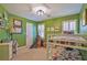 Stylish bedroom with bunk beds, a small teepee, desk with shelves and airplane themed wall art at 1835 Berkeley Ne Mews, Atlanta, GA 30329