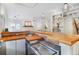 Unique kitchen area with brick countertops, stainless steel appliances, and plenty of natural light at 1835 Berkeley Ne Mews, Atlanta, GA 30329