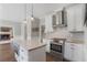 Modern kitchen featuring stainless steel appliances, granite counters, and a central island at 1835 Berkeley Ne Mews, Atlanta, GA 30329