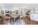 Spacious living room featuring hardwood floors, a fireplace, and built-in bookcases and bar at 1835 Berkeley Ne Mews, Atlanta, GA 30329