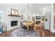 Inviting living area with a white brick fireplace, hardwood floors, and comfortable seating arrangement at 1835 Berkeley Ne Mews, Atlanta, GA 30329