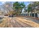 Large backyard featuring a wooded perimeter, mature trees, and a partial fence line at 2230 Rosemoore Walk, Marietta, GA 30062