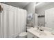 Bathroom with a polka-dotted shower curtain, white vanity, and a well-lit mirror above the sink at 2230 Rosemoore Walk, Marietta, GA 30062