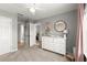 Neutral-toned ' bedroom with white dresser and storage, offering a clean and organized space at 2230 Rosemoore Walk, Marietta, GA 30062