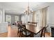 Bright dining area with hardwood floors, chandelier, and views of the office at 2230 Rosemoore Walk, Marietta, GA 30062