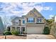 Charming two-story home with blue shutters, a well-manicured lawn, and attached two-car garage at 2230 Rosemoore Walk, Marietta, GA 30062