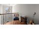 Hallway featuring hardwood floors, a decorative chair, and a guitar at 2230 Rosemoore Walk, Marietta, GA 30062