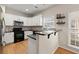 Well-lit kitchen with stainless steel appliances and ample counter space at 2230 Rosemoore Walk, Marietta, GA 30062