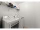 Laundry room featuring white washer and dryer with overhead shelf at 2230 Rosemoore Walk, Marietta, GA 30062