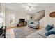 Cozy living room features hardwood floors, a fireplace, and a staircase nearby at 2230 Rosemoore Walk, Marietta, GA 30062