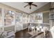 Inviting sunroom featuring tile flooring, multiple windows, and comfortable seating at 2230 Rosemoore Walk, Marietta, GA 30062