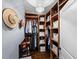 Well-organized walk-in closet featuring custom wood shelving, ample hanging space, and stylish storage solutions at 1216 Mortimer Se Pl, Atlanta, GA 30317