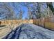 View of the private, fenced-in backyard featuring gravel and grass sections at 543 Paines Nw Ave, Atlanta, GA 30318