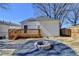 Charming backyard featuring a fire pit, a gravel patio and a deck, perfect for relaxation and outdoor enjoyment at 543 Paines Nw Ave, Atlanta, GA 30318