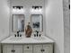 Stylish bathroom vanity with dual sinks, black hardware, and decorative vase at 543 Paines Nw Ave, Atlanta, GA 30318