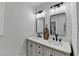 Stylish bathroom vanity with dual sinks, black hardware, and decorative vase at 543 Paines Nw Ave, Atlanta, GA 30318