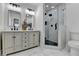 Well-lit bathroom featuring a shower, toilet, and double vanity at 543 Paines Nw Ave, Atlanta, GA 30318