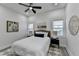 Bright bedroom with ceiling fan, white walls, modern decor, and windows at 543 Paines Nw Ave, Atlanta, GA 30318