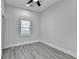Bedroom featuring a ceiling fan, gray floors, and a bright window at 543 Paines Nw Ave, Atlanta, GA 30318