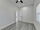 Spacious bedroom with gray flooring, ceiling fan, and a bright window at 543 Paines Nw Ave, Atlanta, GA 30318