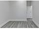 An empty bedroom featuring gray hardwood floors, neutral walls and ample natural light at 543 Paines Nw Ave, Atlanta, GA 30318