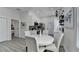 Eat-in kitchen featuring white cabinets, stainless steel appliances, and modern lighting fixtures at 543 Paines Nw Ave, Atlanta, GA 30318