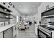 Bright, open-concept kitchen with stainless appliances and view into the dining and living areas at 543 Paines Nw Ave, Atlanta, GA 30318