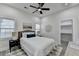 Bright bedroom with ceiling fan, white walls, modern decor, and walk-in closet at 543 Paines Nw Ave, Atlanta, GA 30318
