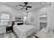 Bright bedroom with ceiling fan, white walls, modern decor, and walk-in closet at 543 Paines Nw Ave, Atlanta, GA 30318