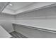 Bright walk-in closet featuring custom shelving and modern gray flooring at 543 Paines Nw Ave, Atlanta, GA 30318