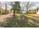 Spacious backyard features a fenced-in yard, storage shed, and mature trees at 1300 Wichita Sw Dr, Atlanta, GA 30311