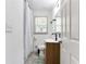 Bathroom featuring modern vanity, grey wood-look flooring, and stylish fixtures at 1300 Wichita Sw Dr, Atlanta, GA 30311